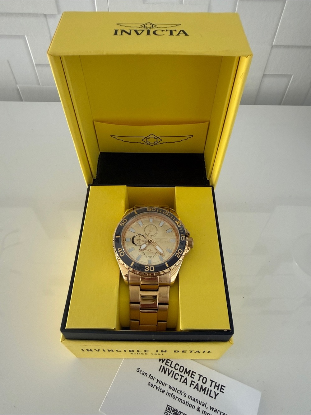 Invicta Gold Tone Watch with Blue Bezel
